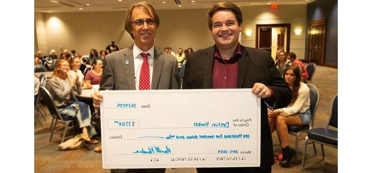 SoC student Destin Hinkel places second in the Three Minute Thesis competition.