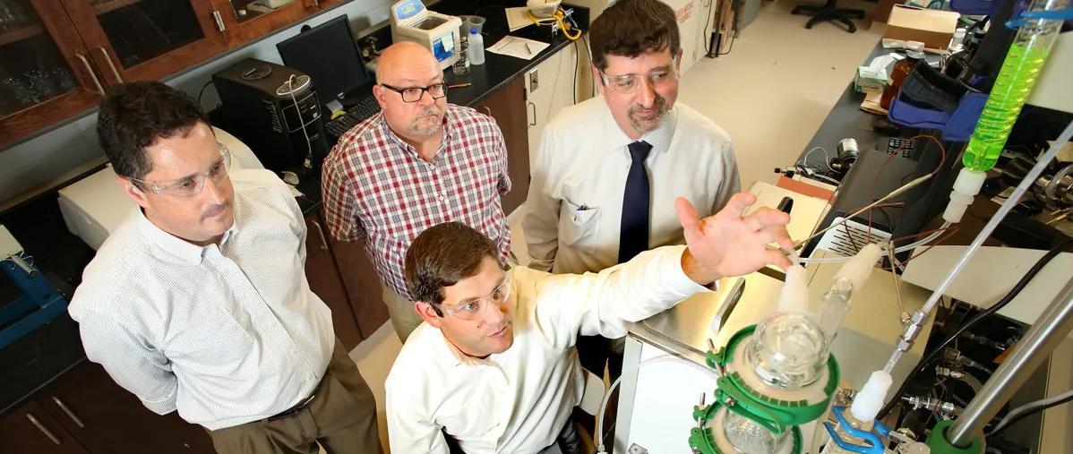 L-R: Matthew Reichert, Grant Glover (seated), James Davis, Kevin West in the laboratory.